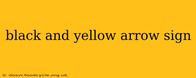 black and yellow arrow sign
