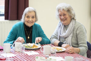 Photo of Maureen and Jen eating a meal together